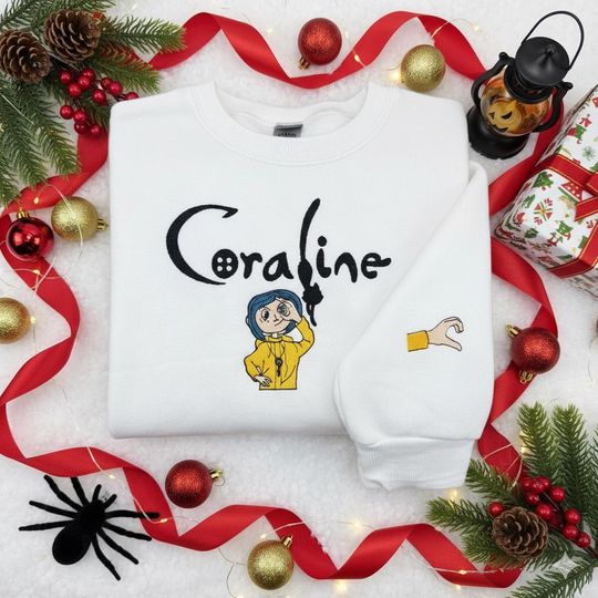 Discover Coraline Inspired Sweatshirt and Tee with Black Cat and Pink Palace Scene, Cozy Halloween Movie Crewneck Gift for Fans of Spooky Adventures