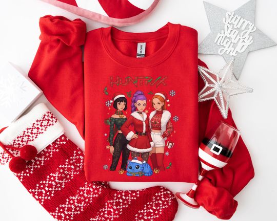 Discover HUNTRX Christmas Sweatshirt, Festive Empowerment Holiday Apparel, Fashion-Forward Xmas Wear for Unique Holiday Celebrations