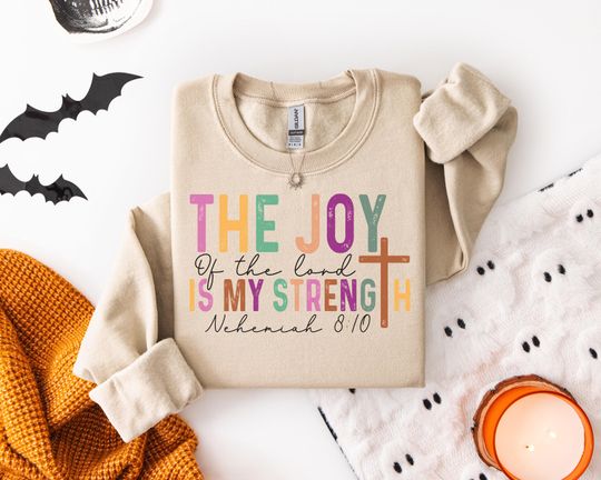 Discover Inspirational Christian Sweatshirt for Faithful Hearts with Vibrant Colors Featuring Joy Strength and Bible Verse Nehemiah 8:10