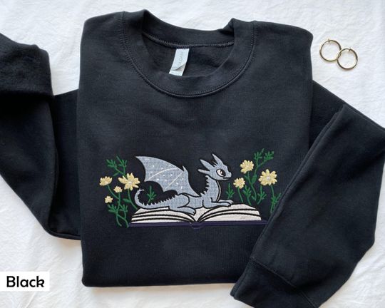 Discover Embroidered Dragon Book Sweatshirt, Fantasy Sweatshirt, Bookworm Sweatshirt, dragon sweatshirt, bookish sweatshirt, book club sweatshirt