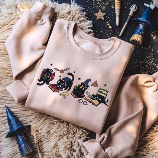 Discover Embroidered Wizard House Cat Christmas Sweatshirt, Wizard Cat Bookish Shirt, Cat Book Lover Gift, Wizard School Shirt, Magical Castle Shirt