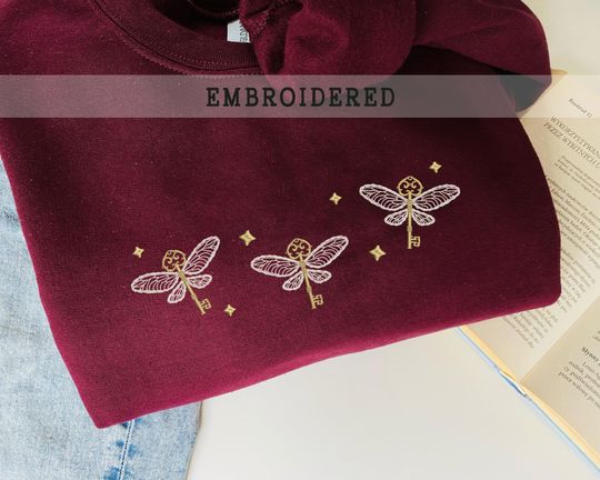Discover Embroidered The Winged Keys, Flying Key, Wizard Wand Shop Embroidered Sweatshirt, Wizard Book Shop, Gift For Book Nerd, Bookish Pullover