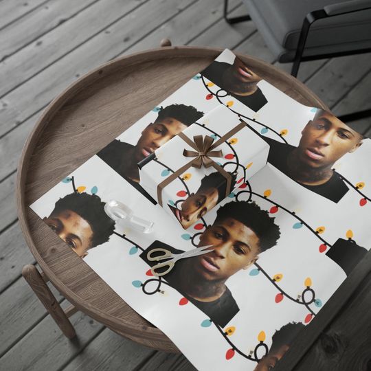 Discover NBA YoungBoy Christmas Wrapping Paper: Colorful Lights, Rap Fan Gift