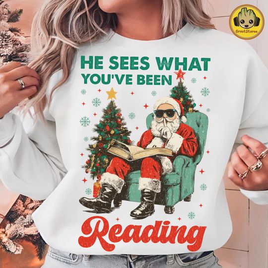 Discover Christmas Reading Sweatshirt with Santa and Bookish Design for Holiday Fans
