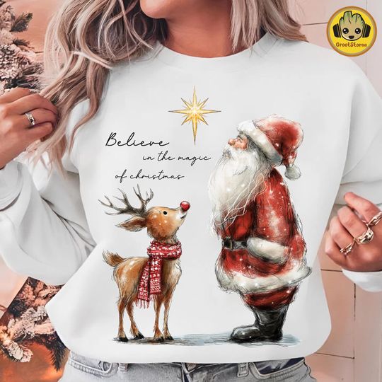 Discover Retro Christmas Believe in the Magic, Santa Claus and Reindeer Holiday Art, Whimsical Holiday Friends Sweatshirt