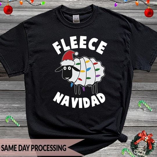 Discover Fleece Navidad Christmas T-Shirt, Cute Sheep Xmas Tee, Sheep with Light, Santa Xmas Shirt, Sheep Lover Tee, Funny Sheep Shirt
