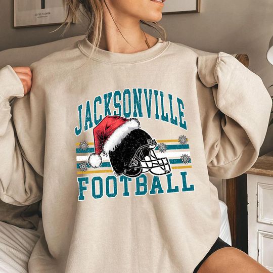 Discover Jacksonville Football Christmas Sweatshirt, Santa Hat Helmet Holiday Crewneck, Vintage Winter Game Fan Gift, Unisex Xmas Top