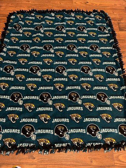 Discover two piece hand tied Jacksonville Jaguars fleece blanket
