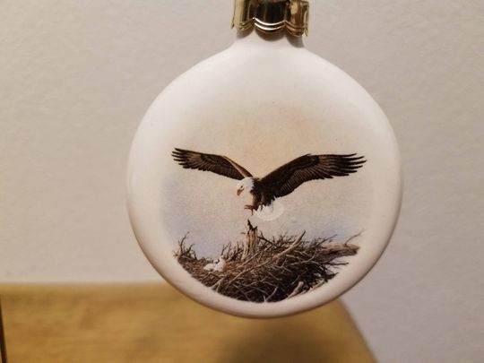 Ceramic Eagle taking care of her young decal fired on Clear Glazed Ornament (#1233)