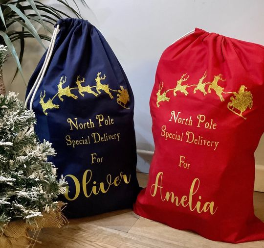 Discover XL Personalised Luxury Santa Sack In Red Or Navy Blue With Gold Glitter Reindeers