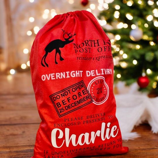 Discover XL Personalised Christmas Present Santa Sack From The North Pole - Red