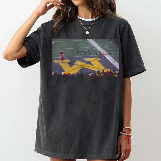 Discover Brutus Ohio State Snow Football Shirt, Ohio vs Michigan Crossing Out M Shirts