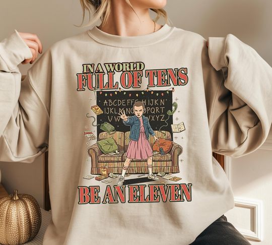 Discover In A World Full Of Tens Be An Eleven Shirt, Stranger Style Funny Sweatshirt, 80s TV Show Fan Gift Tee For Holiday Lovers