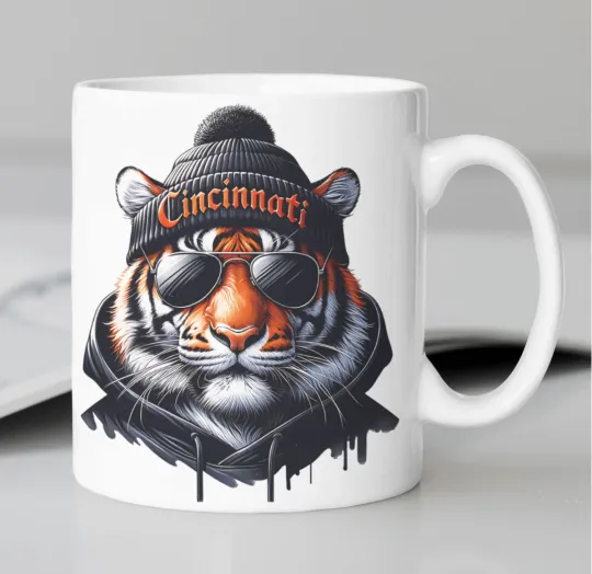 Discover Cincinnati Bengals Mascot coffee mug stating, "CINCINNATI"