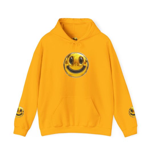 Discover Hoodie Gold Smiley Face Hoodie, hoodie carries a playful, slightly surreal energy