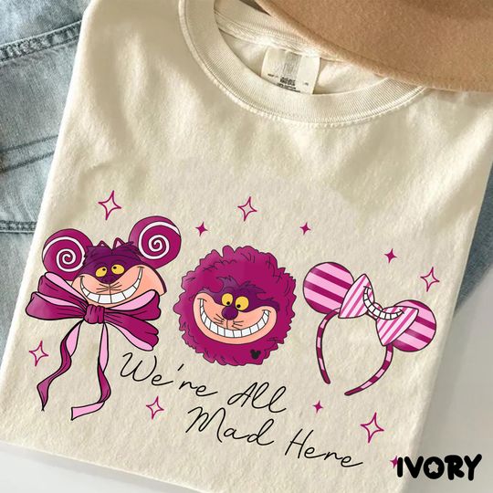 Discover Cute Disney Smiling Cheshire Cat Coquette Bow Shirt, Were All Mad Here Quote Tee, Alice In Wonderland Cat Shirt, Disney Cat Lover Gift