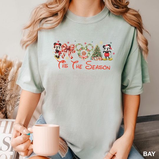 Discover Coquette Bow Tis The Season Disneyland Christmas Shirt, Comfort Colors Shirt,Christmas Tis The Season Shirt, Merry Christmas Shirt, 133768