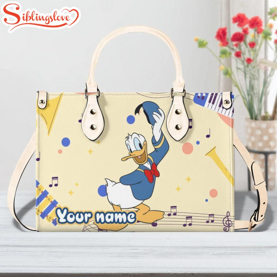 Discover Custom Name Cute Donald Duck Music Leather Handbag