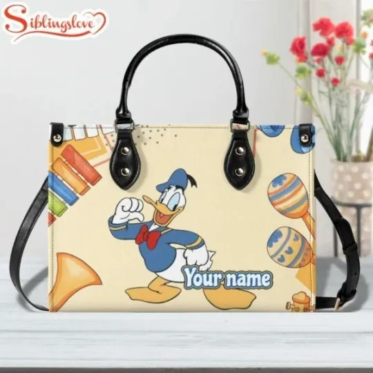 Discover Custom Name Cute Donald Duck Dance Leather Handbag