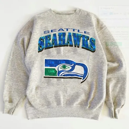 Discover Seattle Seahawks logo graphic ash Sweatshirt