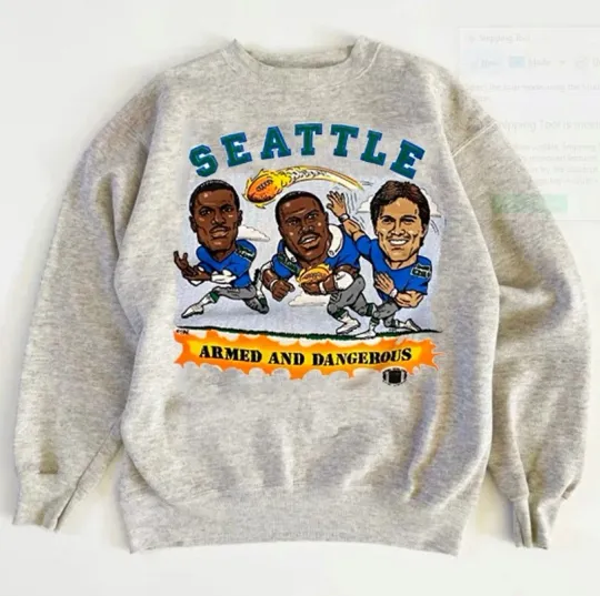 Discover Seattle Seahawks caricature graphic ash Sweatshirt