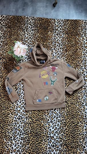 Discover Vintage Y2K Hollister NBA Hooded Sweatshirt All Over Team Logos Size XS  Brown