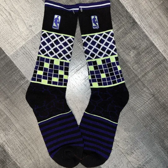 Discover NBA LOGO MAN BASKETBALL BLACK PURPLE SHOWCASE CREW LENGTH SOCKS MEDIUM LOGOMAN