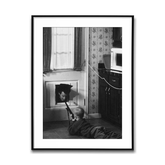 Discover Macaulay Culkin Pointing A Gun Against A Burglar; Black & White Wall Art Poster, Vintage Print, Photography Prints, Aesthetic Poster