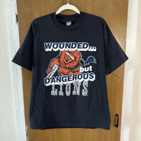 Discover Vintage Single Stitch Made in USA XL Detroit Lions Wounded but Dangerous T-shirt