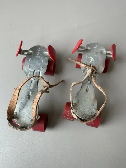 Discover Vintage Adjustable Strap Roller Skates | Red Wheels | Metal Base