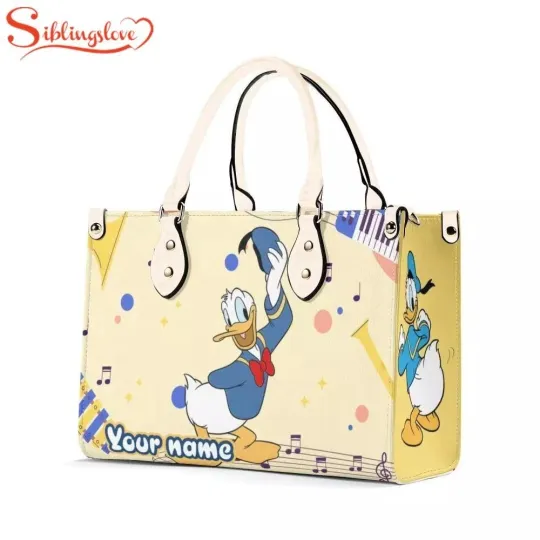Discover Personalized Name Donald Duck Music Women Leather Handbag