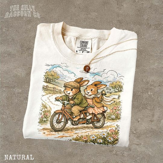 Discover Vintage Rabbit Bicycle Tee Cottagecore Bunny Shirt Whimsical Storybook Animal Gift