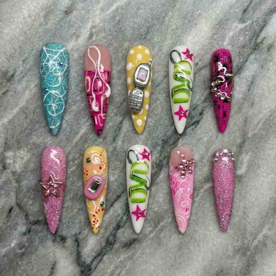 Discover Handmade Y2K Nostalgia Press On Nails | Retro Phone, Stars & Glitter Swirl Art | Long Stiletto Nails For Playful Y2K Vibes
