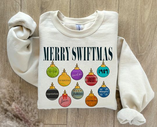 Discover Merry Swiftmas Sweatshirt, Cute Famous Christmas Ball Shirt, The Eras Tour Christmas shirt