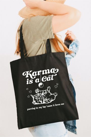 Karma is a cat purring in my lap tote bag