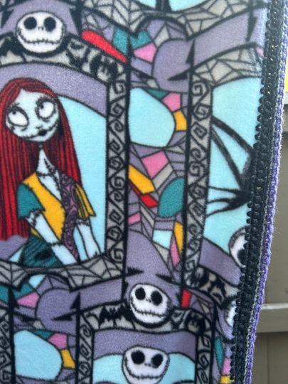 Nightmare Before Christmas Fleece Blanket Showcasing Sally and Jack