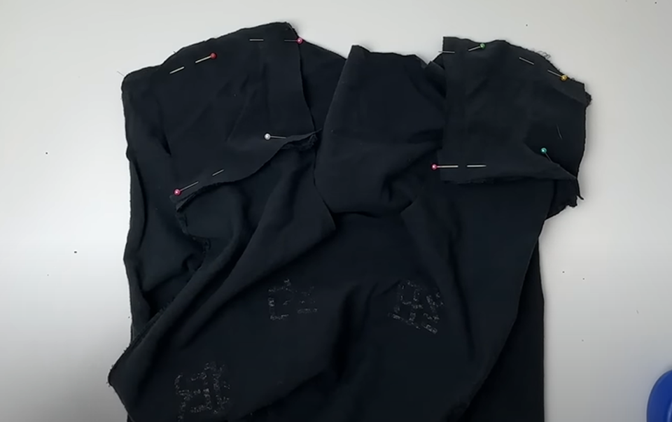 Pinning the sides of the t-shirt