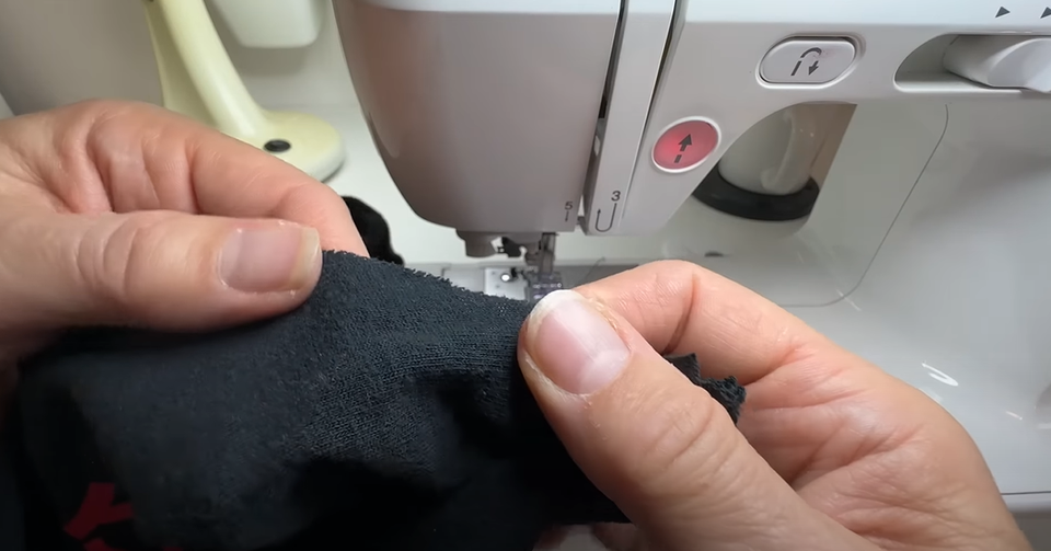 Sewing the pinned lines of the shirt