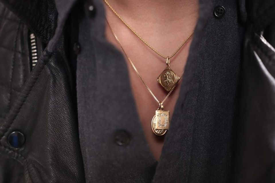 Layering necklaces under a collared shirt