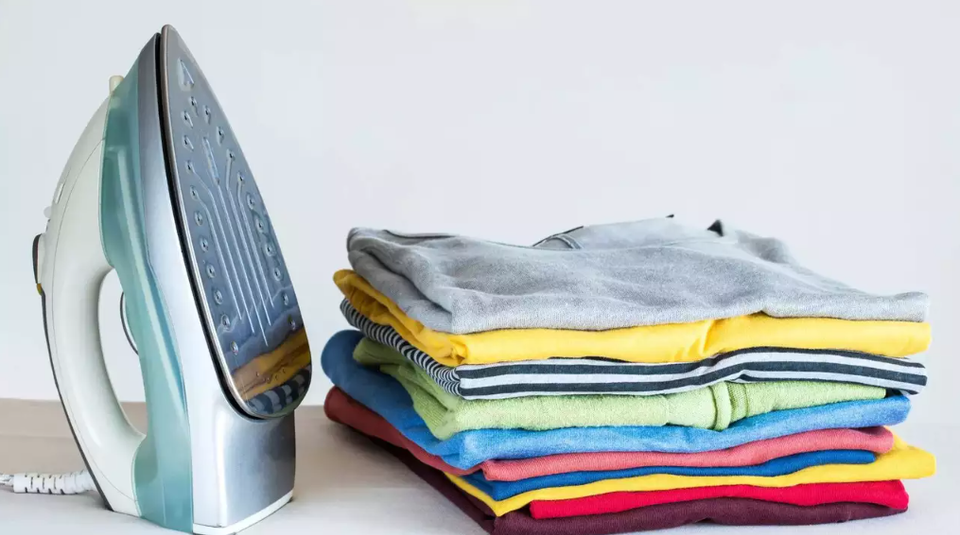 Using a steam iron to shrink a shirt without damaging graphics