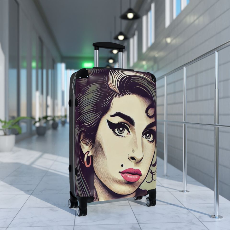 Discover our elegant and durable travel suitcase, ideal for all your trips, Lightweight, spacious and secure, Amy Winehouse Suitcase