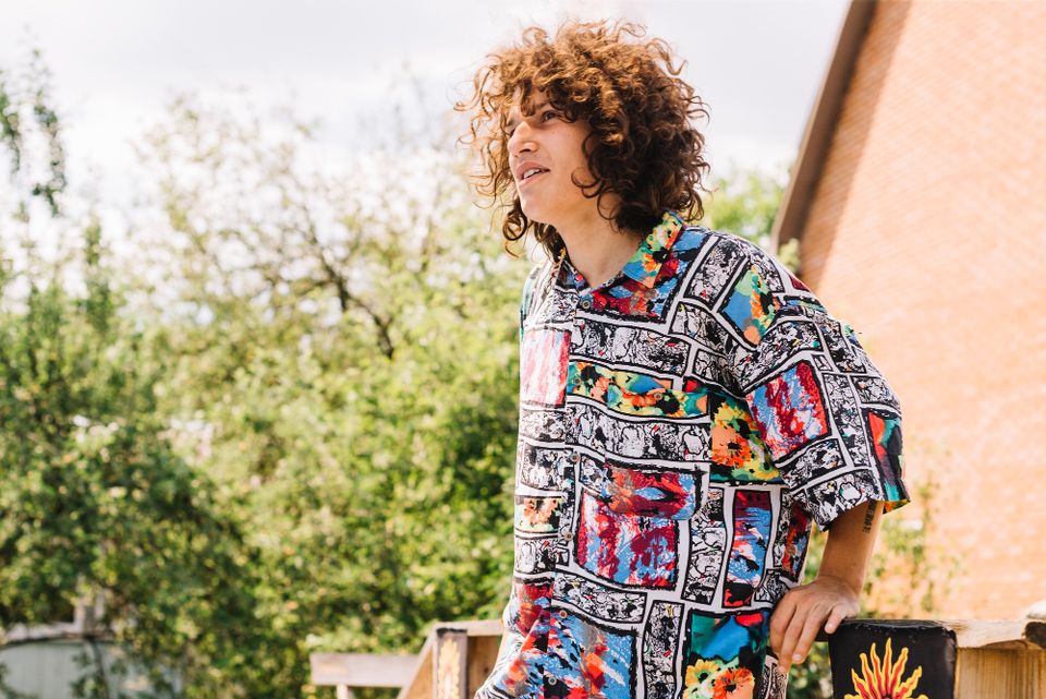 man wearing a vibrant Hawaiian shirt 