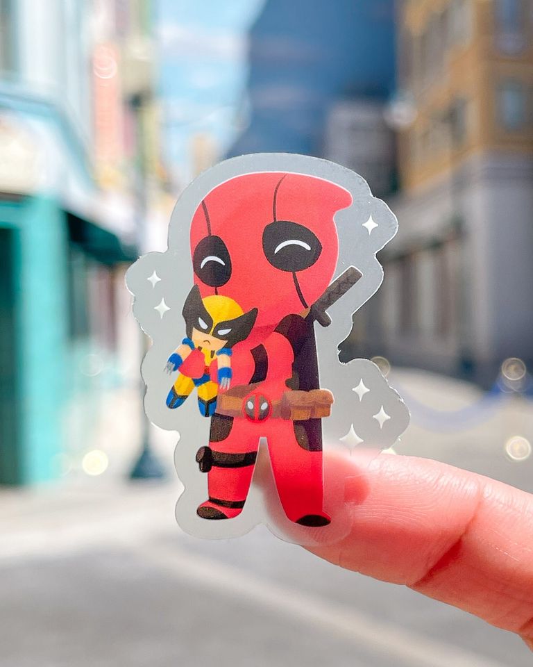 Deadpool with Classic Wolverine Plushie Transparent Disney Laptop Sticker