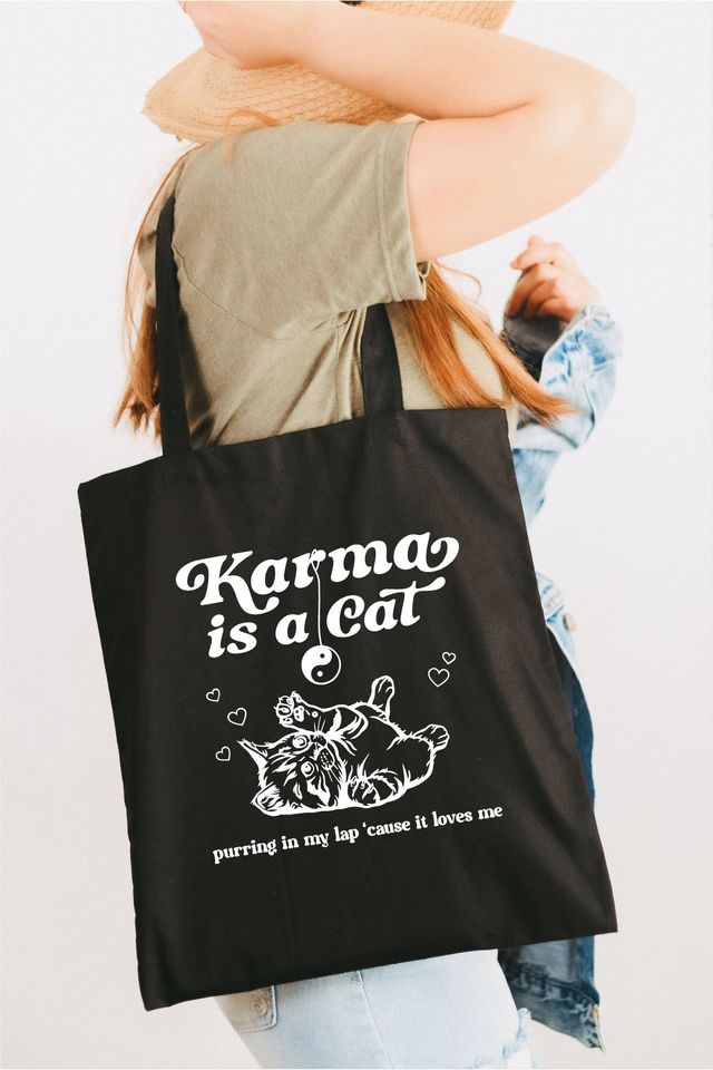 Karma is a cat purring in my lap tote bag
